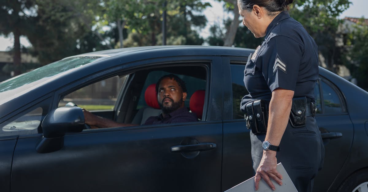 Does Mafia 3 have the option for Lincoln to drive himself? - Man in Black T-shirt and Blue Denim Jeans Holding White Paper Standing in Front of on on on on