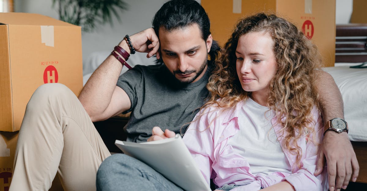 Does moving affect incense? [duplicate] - Pensive male and female in casual clothes sitting together among boxes and writing notes in notebook while leaning on bed