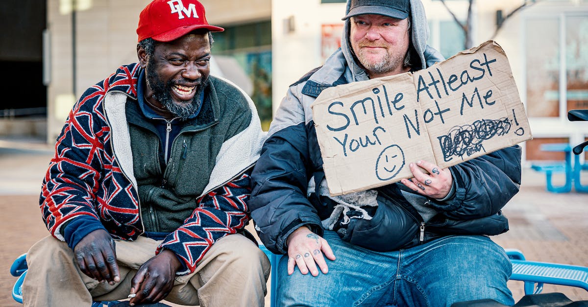 Does my friend have to download all the mods or just me? [duplicate] - Positive middle aged man showing carton with smile at least your not me inscription while sitting on bench with laughing African American male friend