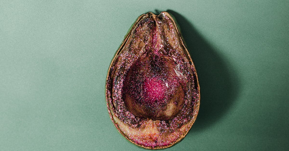 Does Nova spoil Legacy? - From above of half of rotten avocado covered with pink glitter placed on green background in studio Does Nova spoil Legacy? - From above of half of rotten avocado covered with pink glitter placed on green background in studio
