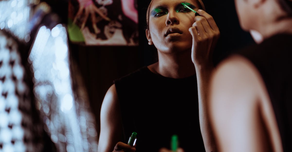 Does paint only apply to certain types of blocks? - Ethnic woman doing modern bright makeup in salon Does paint only apply to certain types of blocks? - Ethnic woman doing modern bright makeup in salon