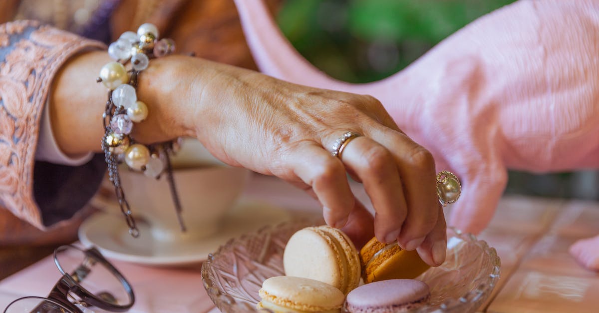 Does picking up food do anything? - Close-Up Photo of Person Picking Up Macaroons Does picking up food do anything? - Close-Up Photo of Person Picking Up Macaroons