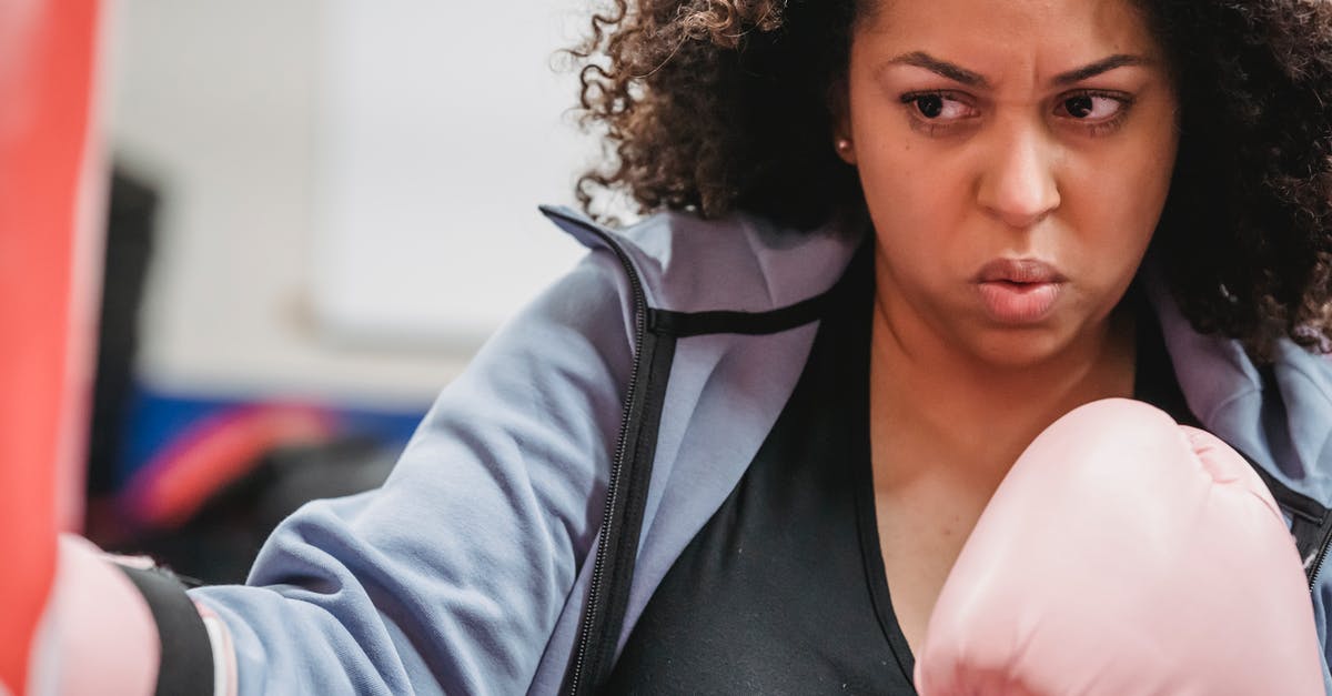 Does pokemon size (XS/Normal/XL) influence attack power? [duplicate] - Crop plump African American woman in boxing gloves doing hit of punching bag during hard training in gym