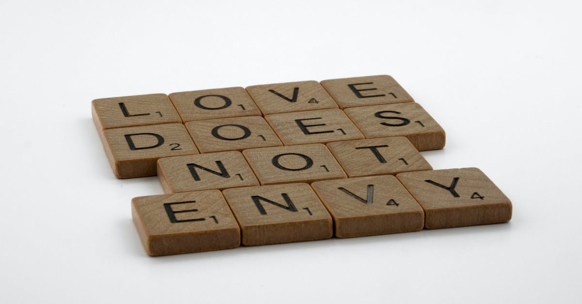 Does "Arrow to the Knee" truly signify marriage? - Close-Up Shot of Scrabble Tiles on a White Surface