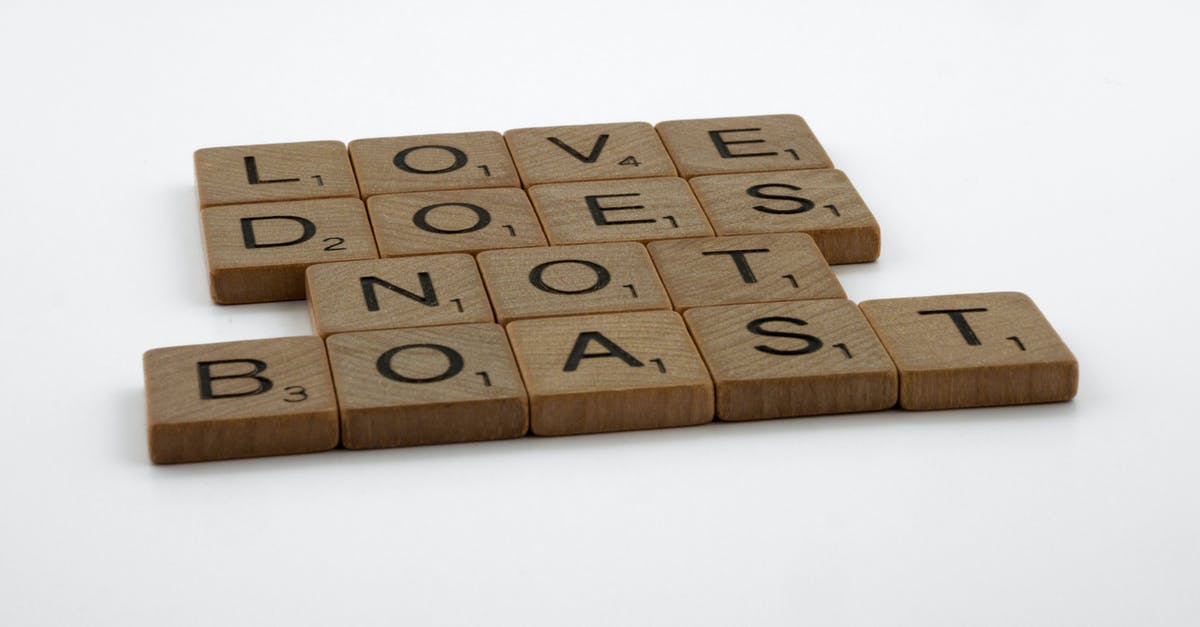 Does "Arrow to the Knee" truly signify marriage? - Close-Up Shot of Scrabble Tiles on a White Surface