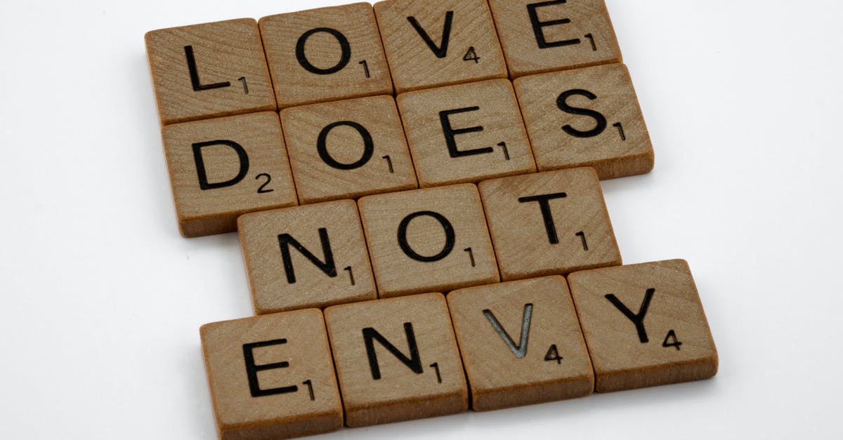 Does "Arrow to the Knee" truly signify marriage? - Close-Up Shot of Scrabble Tiles on a White Surface