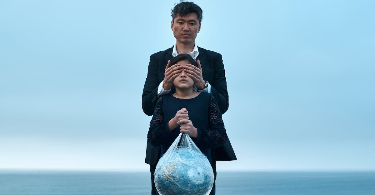 Does razor's static link reduce damage from Ursa's Fury Swipes? - Asian male in formal wear standing near seashore and covering eyes of girl in black dress with Earth globe in plastic bag environment pollution concept