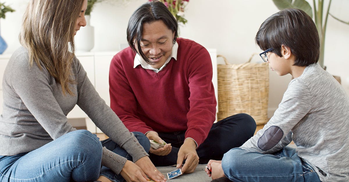 Does settler improvement cards affect settler wagon? - Woman in Red Long Sleeve Shirt and Blue Denim Jeans Sitting on Brown Sofa Does settler improvement cards affect settler wagon? - Woman in Red Long Sleeve Shirt and Blue Denim Jeans Sitting on Brown Sofa