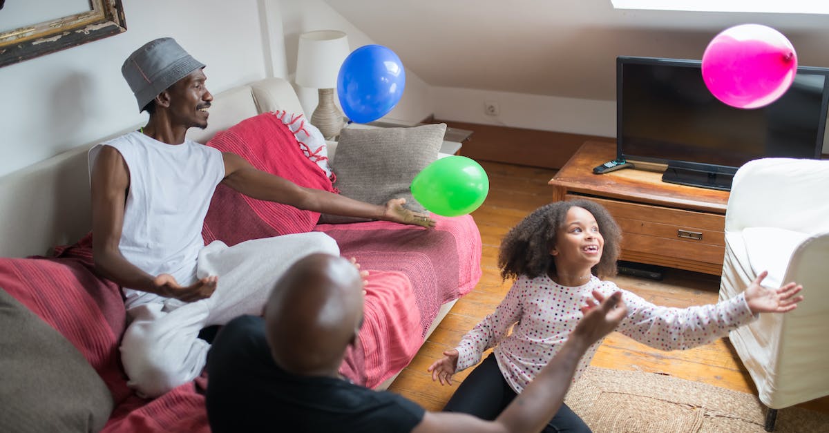 Does Skyrim have invasive expansions? - Men and a Young Girl Playing Balloons Together