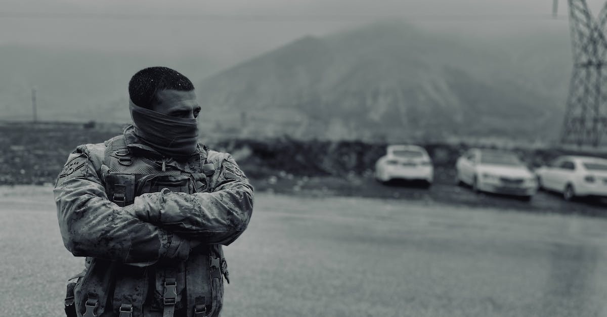 Does soldier rank matter? - Grayscale Photo of Soldier in Military Uniform 