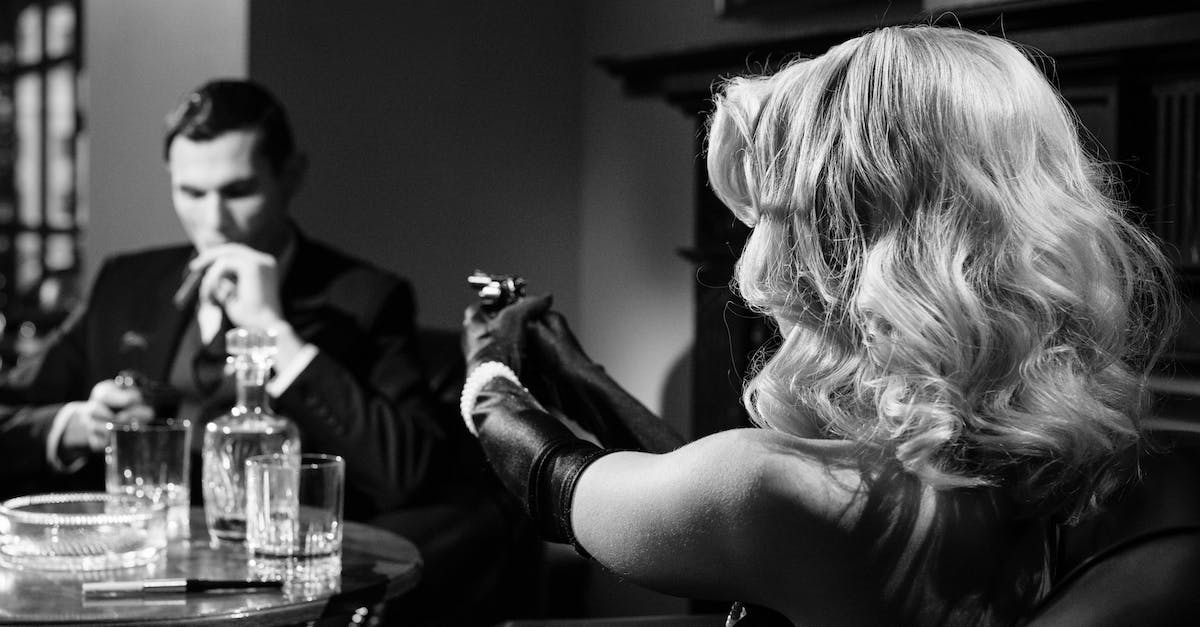 Does stunning enemy types you already captured yield any benefit? - Photo of Female Mobster Pointing the Gun on Man 