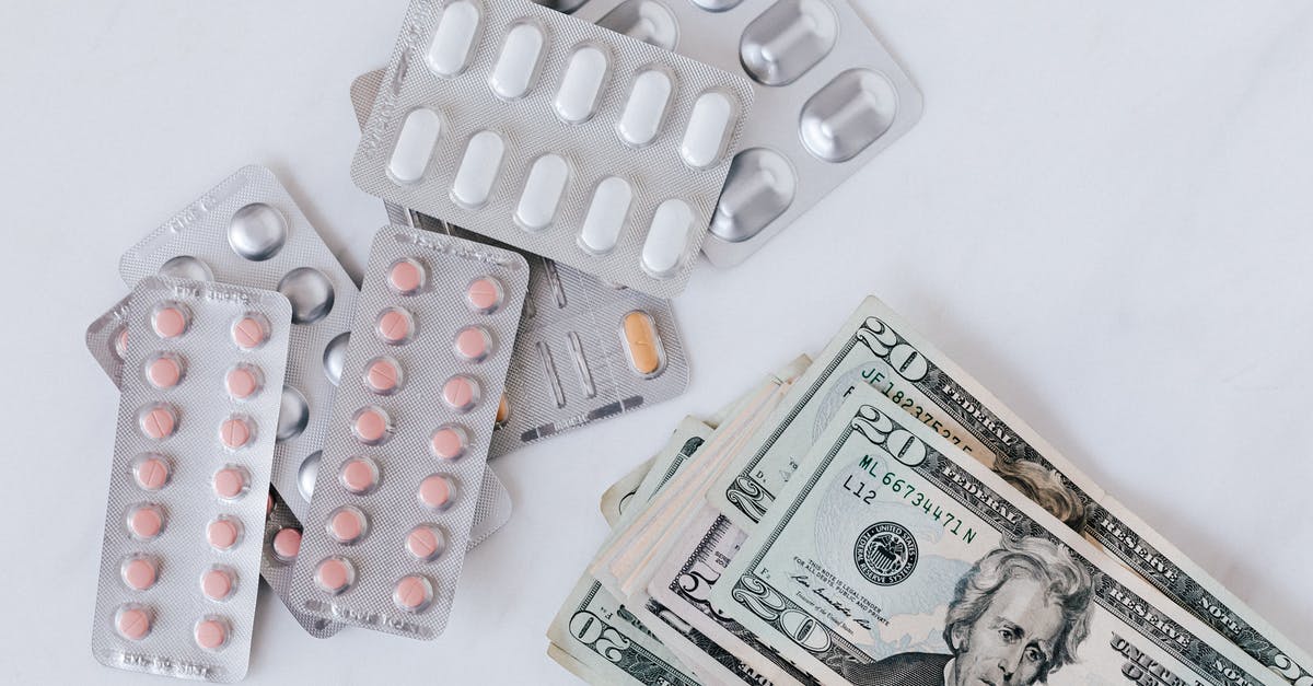 Does the Advanced Warfare Center healing bonus stack with the bonus from HQ? - Top view of different blisters of medications and pills composed with heap of paper money