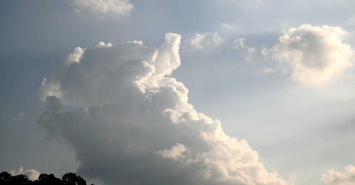 Does the blue highlight indicate anything? [duplicate] - Picturesque landscape scenery of white fluffy clouds in bright sunlight over woods in forest