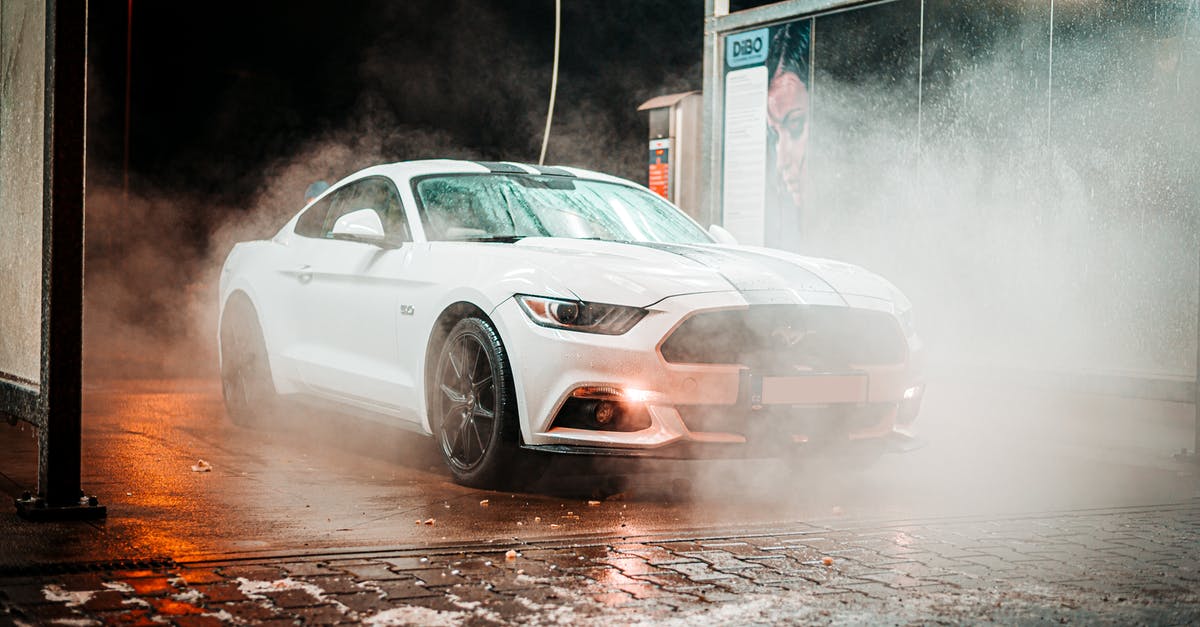 Does the car wash actually wash the car? - Parked White Coupe during Night Does the car wash actually wash the car? - Parked White Coupe during Night