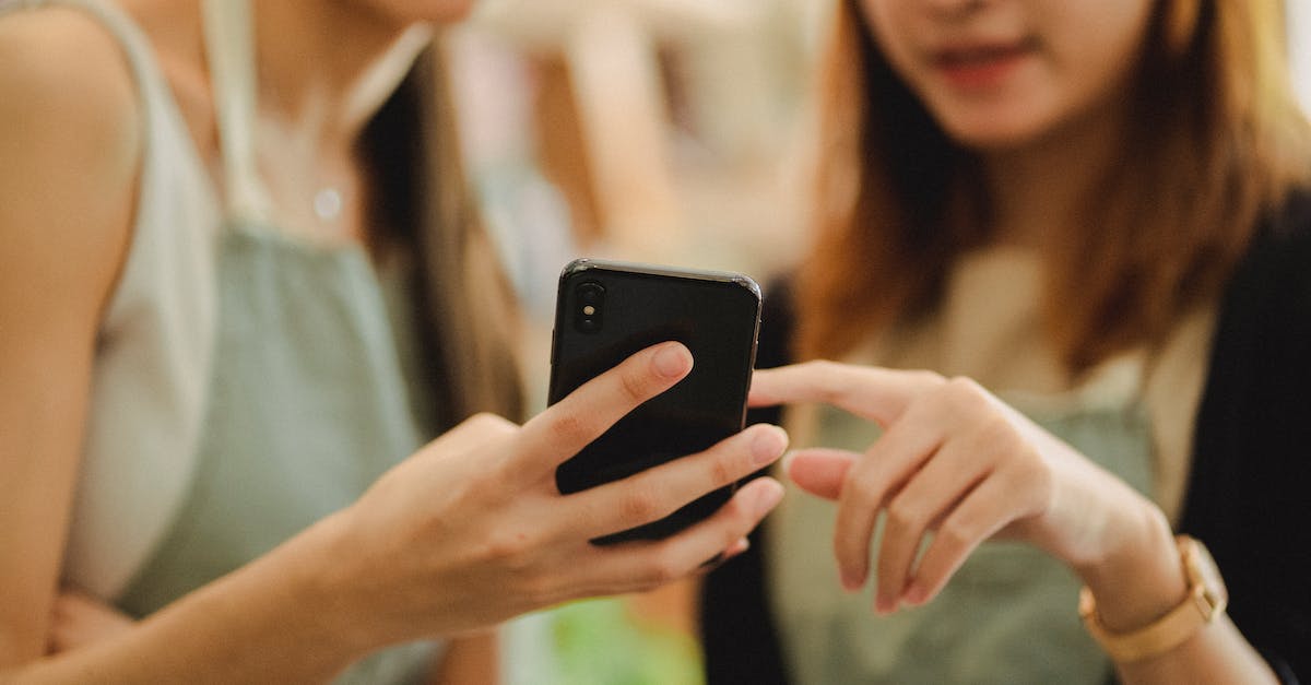 Does the digital download "World of Warcraft" on the blizzard store include the base game, BC, WotLK and Cata? [duplicate] - Crop faceless female florists in apron holding mobile phone while working in floral shop