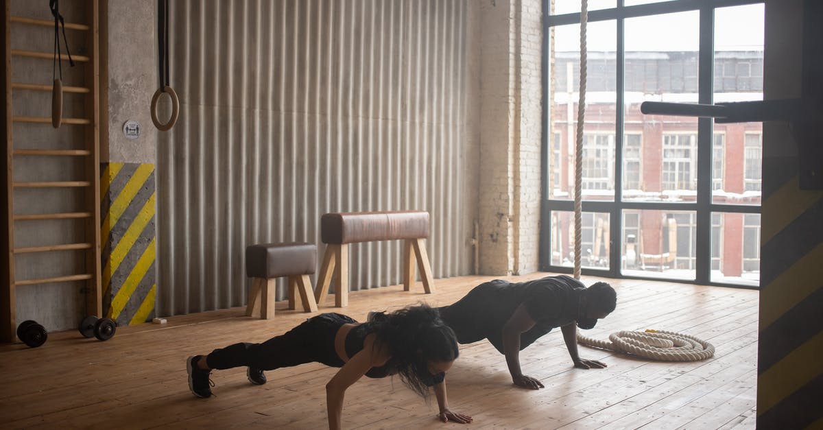 Does the DLT-19 Heavy Blaster have any advantage over the RT-97C? - Unrecognizable black athletes in sportswear and cloth face masks standing in plank pose on floor in gym