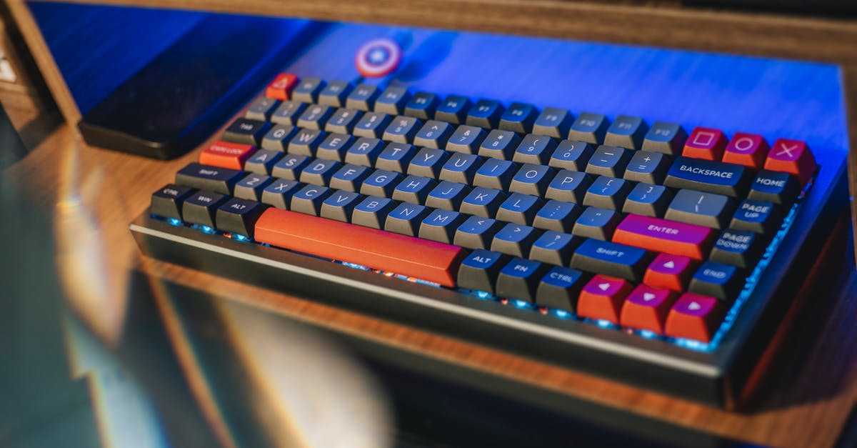 Does the F3 button work on PC? [duplicate] - From above contemporary mechanical keyboard of black and red colors with lightning placed on wooden computer desk