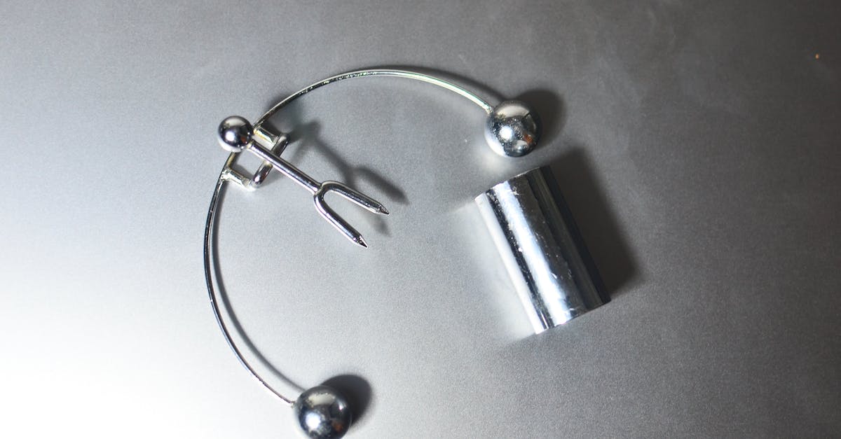 Does the Galnet news play a part in the game? - Top view of metal motion toy of Newton with balancing balls on cradle for home decoration placed on gray background