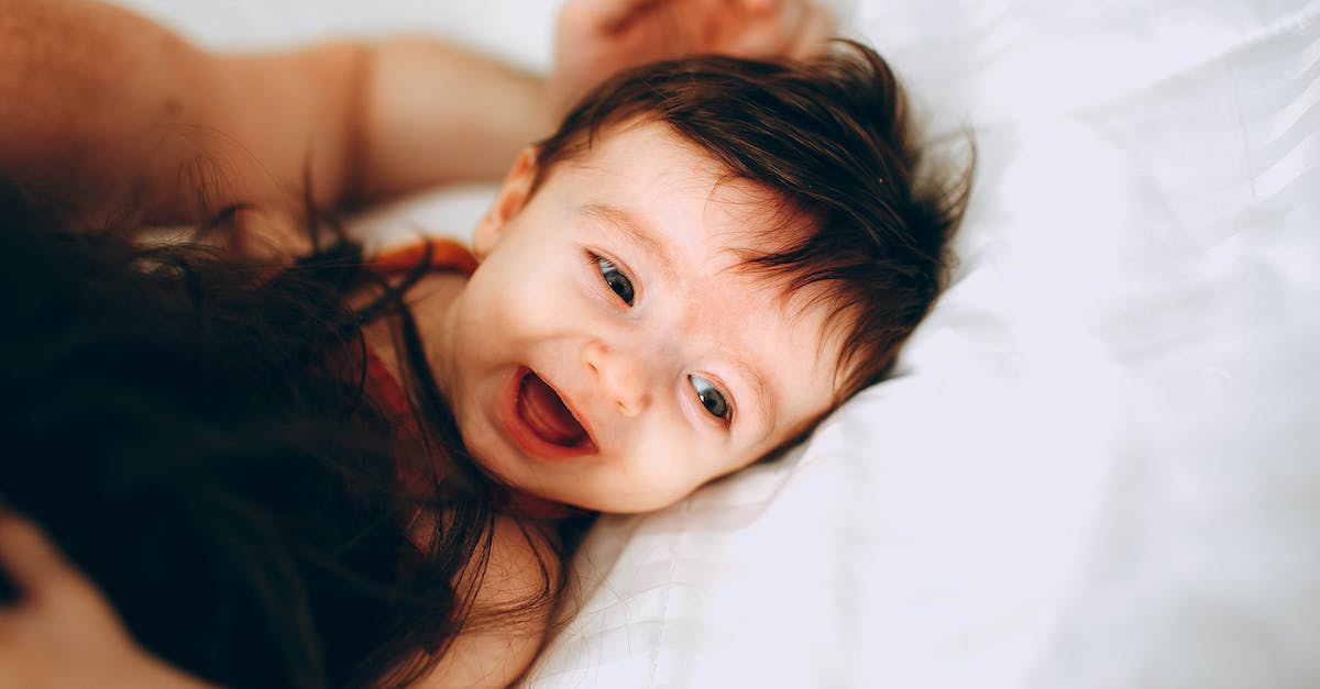Does the game's sexual content affect gameplay? - Happy infant playing with parent in bed Does the game's sexual content affect gameplay? - Happy infant playing with parent in bed