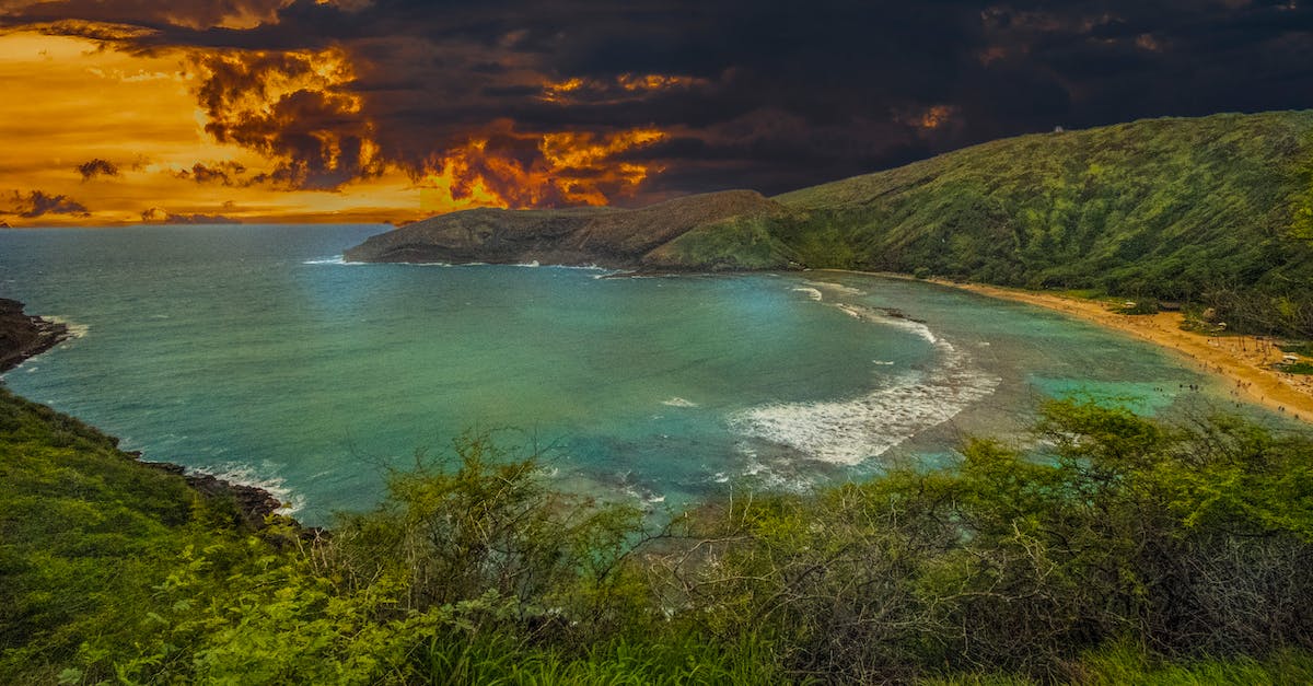 Does the Golden shovel still make rocks give ore? - Landscape Photography of Body of Water Under Gray and Orange Sky