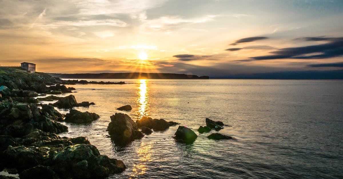 Does the Golden shovel still make rocks give ore? - Rock Formations Beside Body of Water during Golden Hour