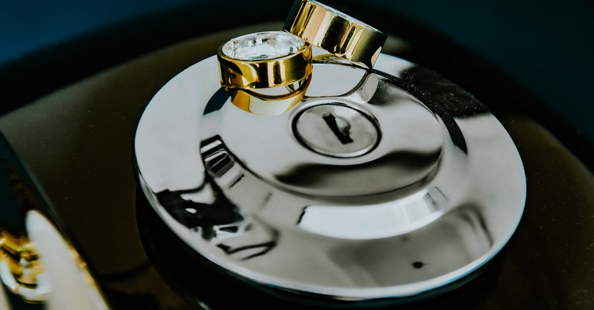 Does the Golden Switch also prevent Wrath cookies? - Creative composition of precious golden wedding rings placed on steel motorbike ignition switch