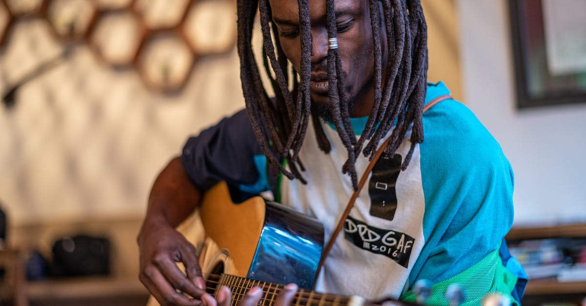 Does the In Rhythm talent stack with itself? - Focused black man playing guitar in studio Does the In Rhythm talent stack with itself? - Focused black man playing guitar in studio