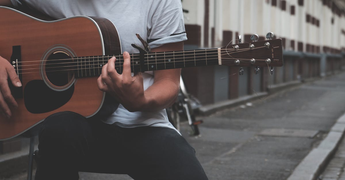 Does the In Rhythm talent stack with itself? - Crop guitarist playing on street Does the In Rhythm talent stack with itself? - Crop guitarist playing on street