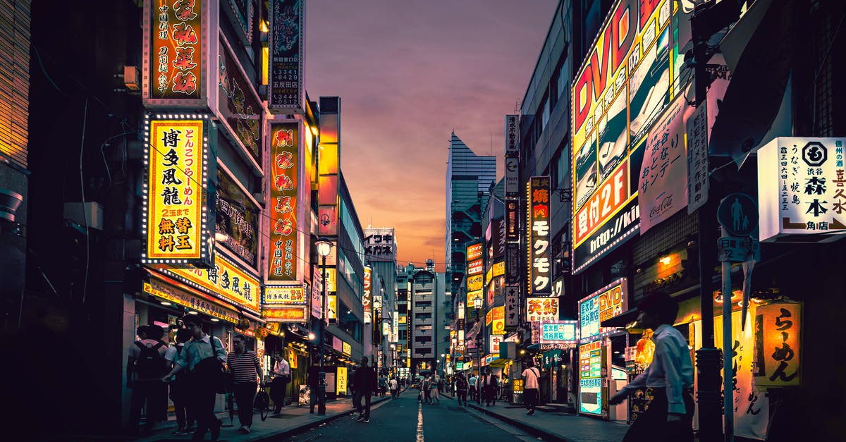 Does the Japanese version of Disgaea 5 have the DLC bonuses? - People Walking on Street Near Buildings Does the Japanese version of Disgaea 5 have the DLC bonuses? - People Walking on Street Near Buildings