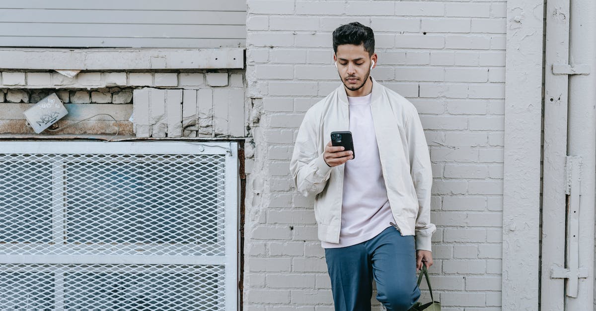 Does the Macho Brace reduce speed? - Trendy Indian man in earbuds chatting on smartphone in town