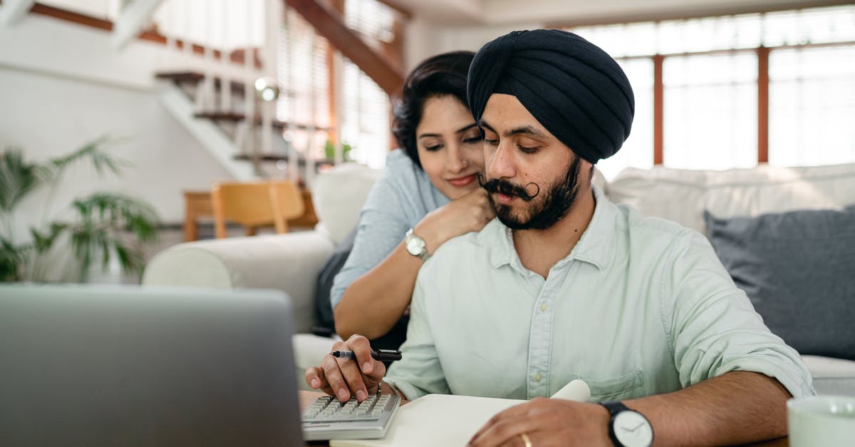 Does the main hero level affect relic count when prestiging? - Young smiling woman hugging concentrated husband from behind while counting bills on calculator in modern apartment Does the main hero level affect relic count when prestiging? - Young smiling woman hugging concentrated husband from behind while counting bills on calculator in modern apartment