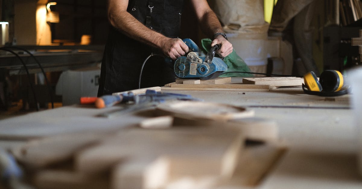 Does the Monk passive skill Unity stack with multiple Monks applying it? - Unrecognizable male artisan using electric belt sander while working at workbench with blurred stack of wooden planks in professional joinery
