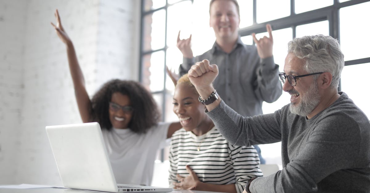 Does the Nintendo Switch Online Family Group allow sharing of eShop games between accounts on different devices? - Happy diverse people raising hands and joyfully laughing while looking at screen of laptop and sitting at table in modern loft styled workspace Does the Nintendo Switch Online Family Group allow sharing of eShop games between accounts on different devices? - Happy diverse people raising hands and joyfully laughing while looking at screen of laptop and sitting at table in modern loft styled workspace