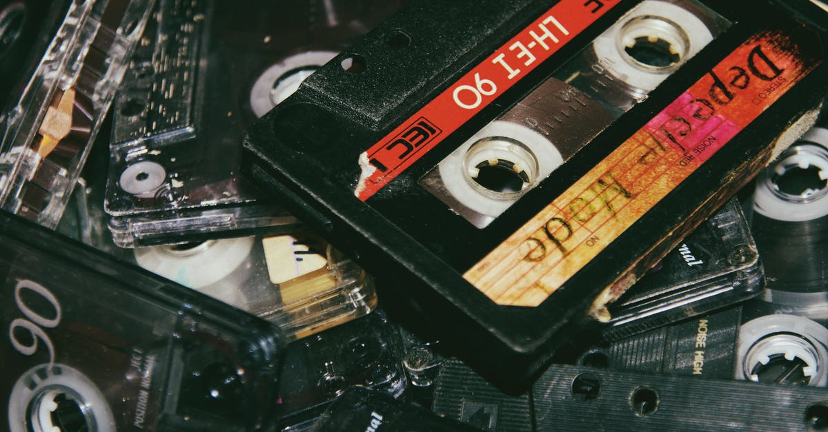 Does the old expansions count as a paid copy of the game? - Collection of vintage audio cassettes on table