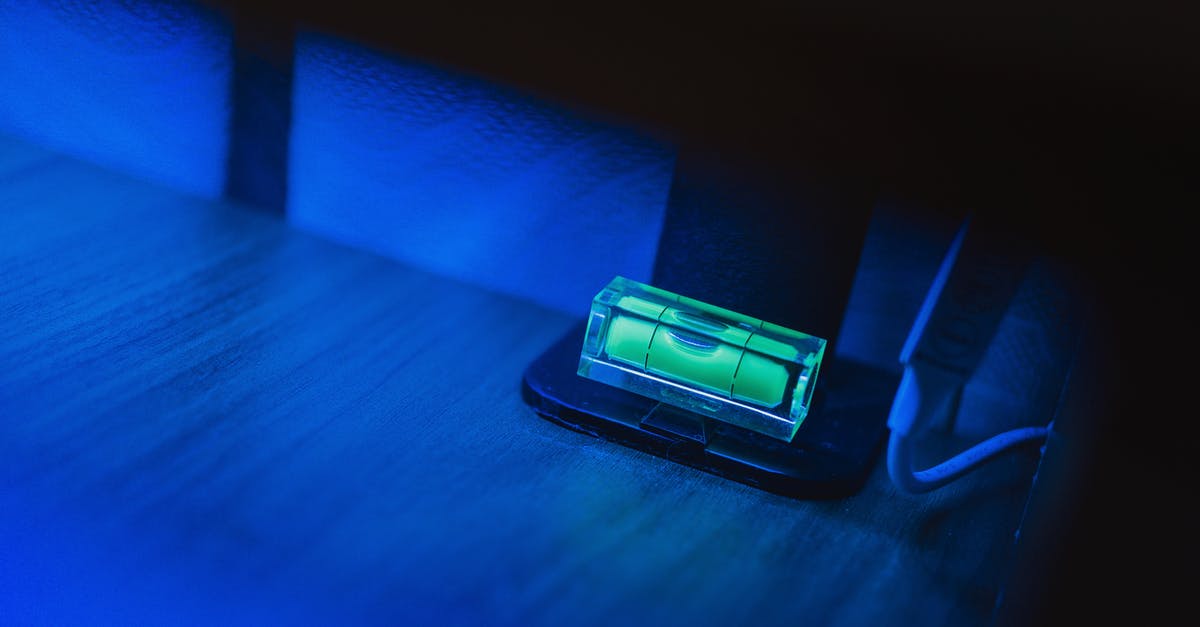 Does the room level affect how much damage deathclaws will do in a room? - Small illuminating green neon bubble level placed on monitor stand in dark room