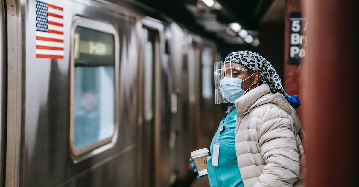 Does the shield of an ADC go down faster? - Nurse in protective mask and coat waiting for train on subway station Does the shield of an ADC go down faster? - Nurse in protective mask and coat waiting for train on subway station