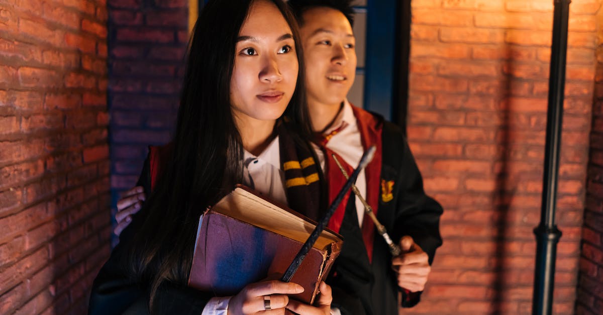 Does the Spell Fencer benefit from higher magic levels? - Young Man and Woman in Black Robes Holding Magic Wands Does the Spell Fencer benefit from higher magic levels? - Young Man and Woman in Black Robes Holding Magic Wands