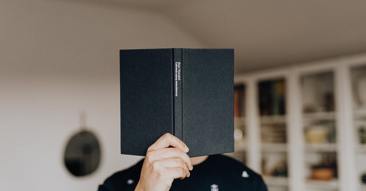 Does the story of LoS integrates with the rest of the franchise? - Faceless male holding opened black book in hand covering face while standing in middle of light room Does the story of LoS integrates with the rest of the franchise? - Faceless male holding opened black book in hand covering face while standing in middle of light room
