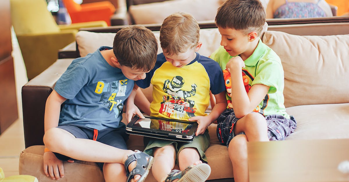 Does the Wii U game pad actually detect breath? - Boys Sitting on Couch Playing on Tablet