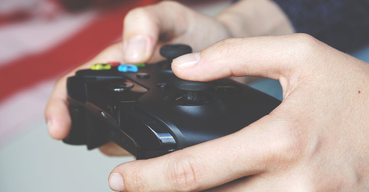 Does the Xbox One controller have pressure sensitive triggers? - Man Holding Black Game Controller