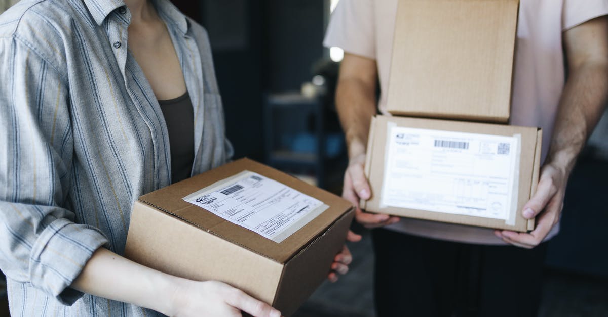 Does Tomb Reaver work with Wirlwind? - Woman in Blue Denim Jacket Holding Brown Cardboard Box