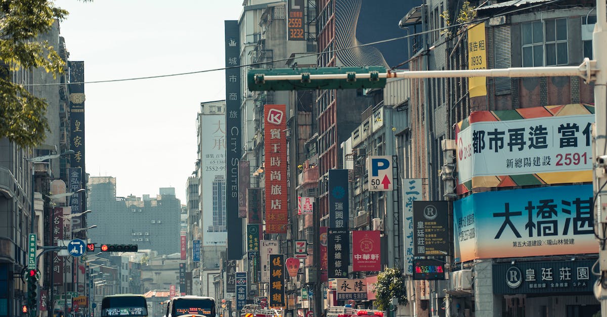 Does traffic encourage commercial properties? - Cars on Road Between High Rise Buildings