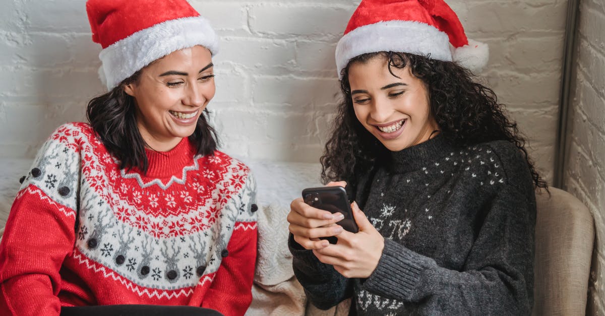Does using explosives affect resources gathered on downed UFO missions? - Positive ethnic girlfriends browsing smartphone during Christmas celebration
