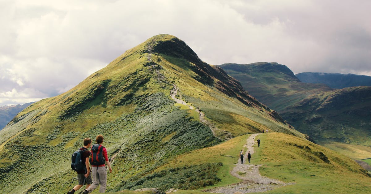 Does walking with a high level trainer give a higher chance to find rare pokemons? - People Standing on Top of Mountain