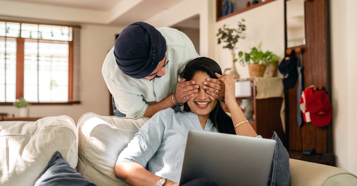 Does Warplanes WW2 Dogfight have any way to be played in multiplayer mode across the internet or LAN? - Cheerful ethnic couple with laptop at home