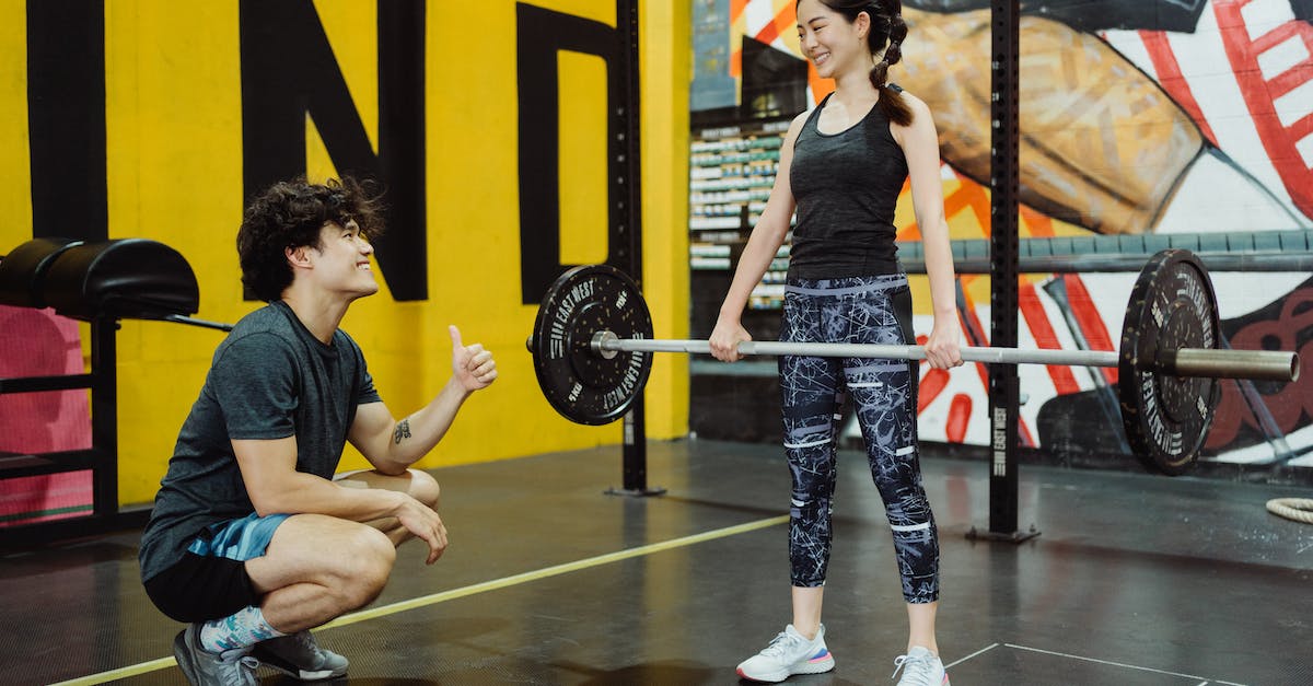 Does weapon weight count in World of Tanks? - Young Athletes Lifting Weights at Gym with a Mural