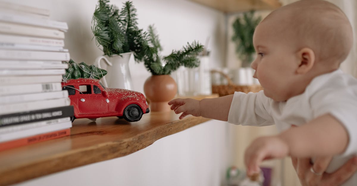 Does what's on my shelves matter? - Boy in White T-shirt Holding Red Car Toy Does what's on my shelves matter? - Boy in White T-shirt Holding Red Car Toy