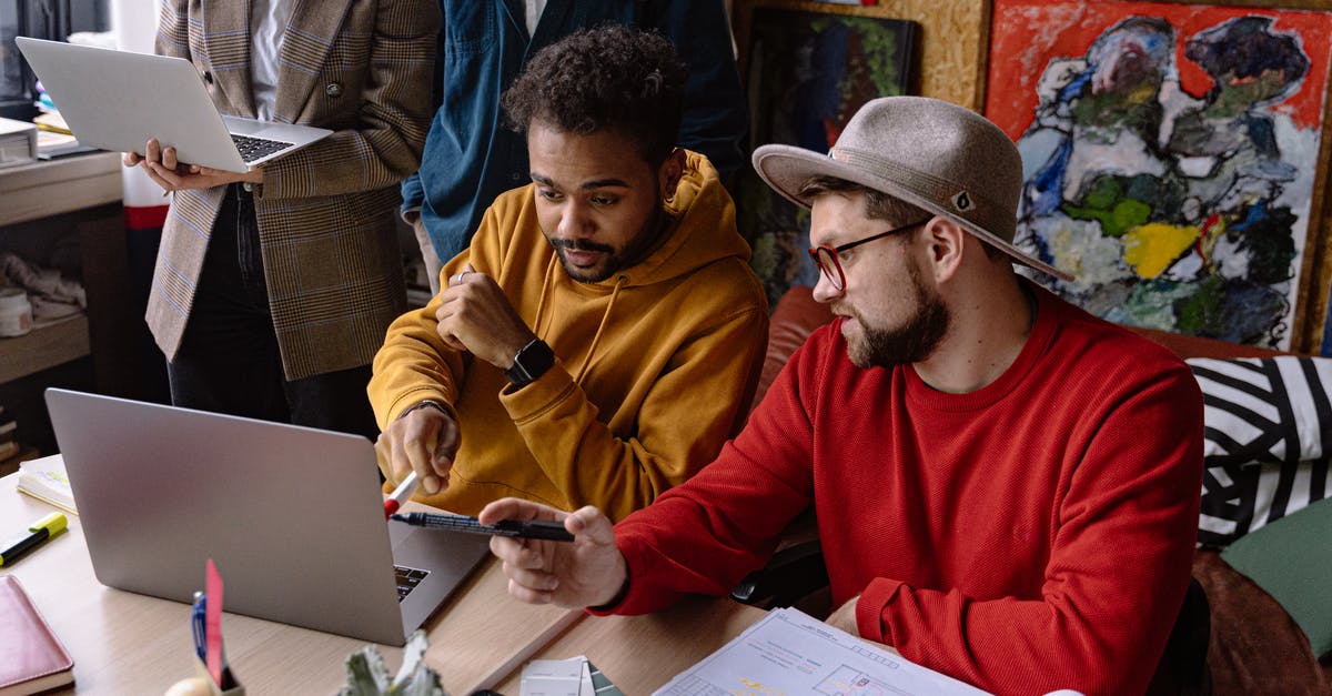 Does workshop provide any unique bonuses? - Man in Red Sweater Sitting Beside Man in Brown Jacket