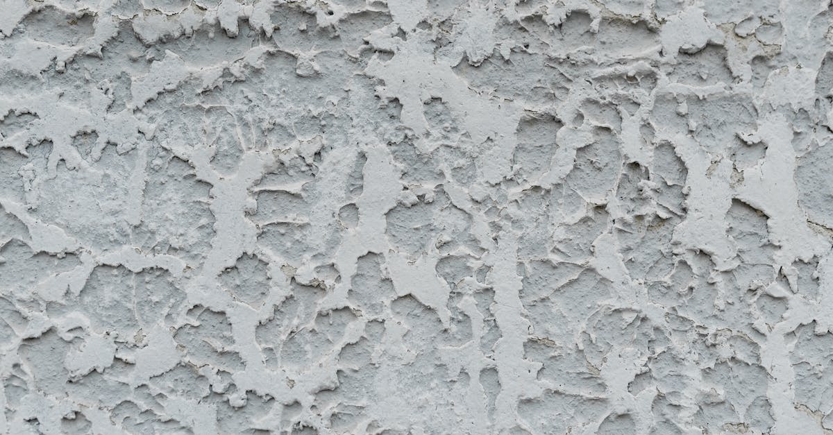Does Wyrdward effect applies for Ancients attacks? - Cracked gray stucco wall with cracked surface
