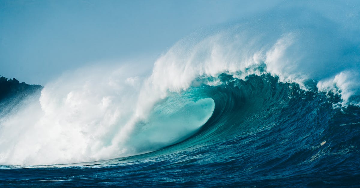 Don't Starve Will Crash Seconds After Launching - Powerful wave rolling and splashing on turquoise sea surface beneath clear blue sky on sunny day